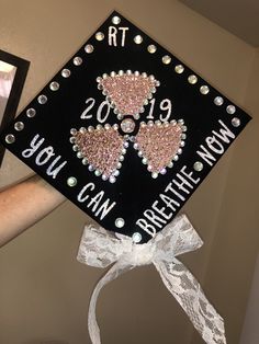 a decorated graduation cap that says, you can breathe now