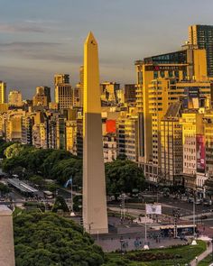 the washington monument stands tall in front of cityscape