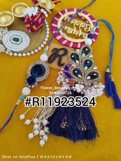 an assortment of jewelry is displayed on a yellow tablecloth with the words happy new year written below it