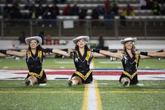 the cheerleaders are performing on the field