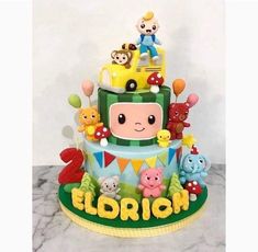 a birthday cake decorated with an image of a cartoon character on the front and sides