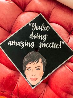 a graduation cap that says, you're doing amazing sweetie on the back