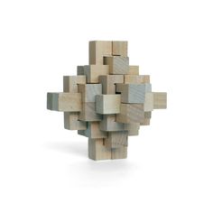 a sculpture made out of wooden blocks on a white background