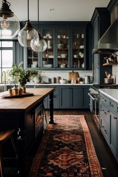 a kitchen with blue cabinets and an area rug