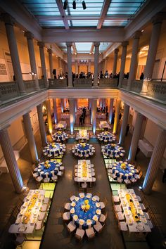 the interior of a building with tables and chairs