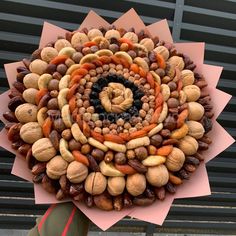 a bunch of nuts arranged on top of each other in the shape of a flower