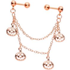 a pair of dangling earrings with chains and bells on the end of each earring