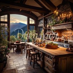 a large kitchen with an open window overlooking the mountains and trees in the evening time