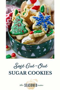 a green bowl filled with christmas cookies on top of a table