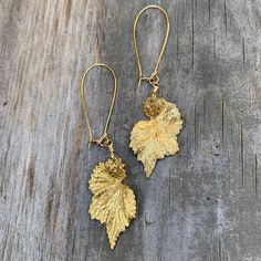 These textured brass begonia-leaf drop earrings are golden, & darling! They can accompany a classy look or add some shine to an earthy combo. They are paired with 18k gold-plated & nickel free kidney ear-wires. They fall at 3.25" long and are 0.75" at the widest part of the leaf. These are the smaller version of the 2 sizes I generally offer. These earrings are both Beautiful & botanical & shimmer with natural beauty ✨ Nickel-free Leaf-shaped Brass Jewelry, Gold Nature-inspired Metal Earrings, Nature-inspired Nickel-free Gold Earrings, Nature-inspired Gold Nickel-free Earrings, Gold Leaf-shaped Nickel-free Earrings, Gold Leaf-shaped Nature-inspired Earrings, Nature-inspired Gold Leaf-shaped Earrings, Yellow Gold Leaf-shaped Brass Earrings, Gold Leaf Shaped Brass Jewelry