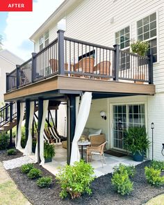 an outdoor deck with stairs leading up to the upper floor and second story above it