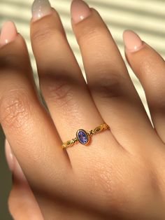 GENERAL INFORMATION * Materials: 18K Vermeil Gold (2.5 Micron Gold plating on a 925 Sterling Silver Base) * Gemstone: Tanzanite * Style - Minimalist/Stacking Ring * Stone Size - 3x5mm Oval * Weight - 1.4 gms (Approx.) * Polish - High Polish  * Quantity: 1 piece CUSTOM RING SIZES * Not seeing your ring size listed? Select the "Custom Ring Size" option and put a note with your ring size at the checkout. * After we receive your order, we will reach out to confirm all sizing details. ABOUT THE PRODU Gold Birthstone Ring With Tanzanite, Gold Tanzanite Birthstone Ring, Gold Minimalist Amethyst Ring For Gift, Minimalist Gold Amethyst Ring For Gift, Gold Tanzanite Birthstone Ring As Gift, Gold Tanzanite Birthstone Ring For Gift, Gold Tanzanite Birthstone Promise Ring, Tanzanite Ring With Round Band, Tanzanite Ring With Round Band For Gift