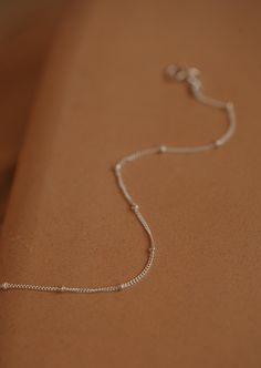 Our most popular layering chain is now available as a bracelet! The perfect addition to any stack and equally darling on it’s own. Bracelet is adjustable from 6.5 - 7". Available in 14kt Gold Fill + Sterling Silver. Handmade in Eau Claire, WI. Our jewelry is handmade so each piece will be unique and may vary slightly from what is pictured. Sterling Silver Bracelets With Tiny Beads For Everyday, Everyday Sterling Silver Bracelets With Tiny Beads, Adjustable Chain Bracelets For Layering, Sterling Silver Bracelet With Delicate Chain For Everyday, Delicate Chain Sterling Silver Bracelet For Everyday, Everyday Sterling Silver Bracelet With Delicate Chain, Adjustable Dainty Sterling Silver Bracelet For Everyday, Dainty Adjustable Sterling Silver Bracelet For Everyday, Dainty Sterling Silver Adjustable Bracelet For Everyday