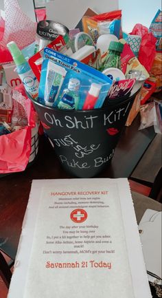 a basket filled with personal care items sitting on top of a table next to a sign