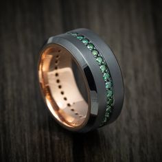 This Black Zirconium ring features:- A Bead Finish- A High-Bevel Design- 10mm Width- Eternity-Set .03ct Round Green Diamonds- Full 14K Gold Sleeve (Rose Gold Shown) Men's Diamond Rings, Zirconium Ring, Mens Wedding Bands Black, Black Titanium Ring, Black Zirconium Ring, Green Diamond Rings, Emerald Wedding Band, Cabin Wedding, Emerald Wedding Rings