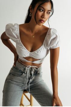 White Puff Sleeve Sweetheart Crop Top - Strappy Cutout Top Chic Low-cut Crop Top For Spring, Feminine Cropped Top For Vacation, Spring Low-cut Crop Top, Chic Low-cut Summer Crop Top, Trendy Low-cut Crop Top For Spring, Flirty Cropped Crop Top For Day Out, Flirty Cropped Top For Day Out, Flirty Cropped Top For Spring, Fitted Tied Crop Top