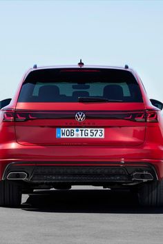 the rear end of a red volkswagen vehicle