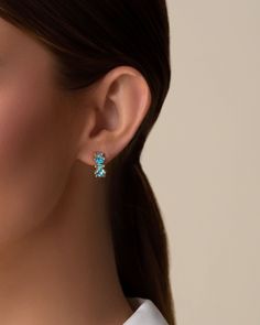 Crafted in 14-karat gold, are set with a stunning array of multi-cut blue ombre gemstones, creating a vibrant spectrum of color. Perfect for both day and evening wear, these earrings bring a splash of warmth and sophistication to your look. Details 14k yellow gold 4x2mm baguette-cut paraiba and Swiss blue topaz 5x5mm hexagon-cut paraiba and Swiss blue topaz 12mm hoops Ref: PE739F Swiss Blue Topaz, Baguette Cut, Blue Ombre, Evening Wear, Blue Topaz, Baguette, Topaz, Yellow Gold, Gemstones