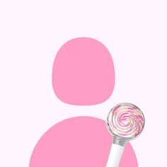 a close up of a pink and white candy lollipop on a pink background