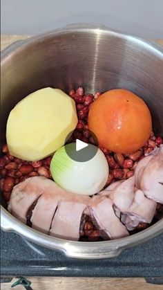 an image of food being cooked in a pot on the stove top with eggs and meat