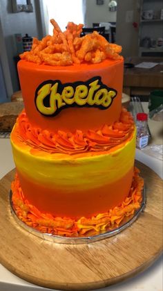 a three tiered cake with the word cheetos on it