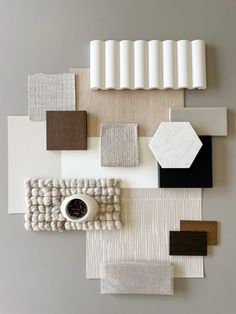 an arrangement of different colors and materials on the wall