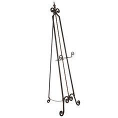 a black metal easel with an iron frame and two hooks on the bottom shelf