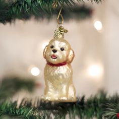 a dog ornament hanging from a christmas tree