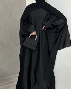 *FALL 2023 COLLECTION* Welcome to our most versatile abaya from our whole entire collections. This fully closed Farasha (butterfly cut) abaya is made of a very lightweight yet durable fabric, that will keep you cool in those warmer days. The best abaya to wear during Umrah or Hajj as the fabric is lightweight and does not retain heat. It's very versatile and can be worn while running errands or even styling it up for a more formal event. The model is 1.80 m and wears size 58'. Abaya Material: Lightweight Washed Silk Fabric. Scarf Material: 100% High Quality Laser Chiffon Care instructions: Dry Cleaning Recommended Evening Solid Color Maxi Length Abaya, Evening Solid Maxi Length Abaya, Evening Maxi Length Solid Abaya, Black Long Sleeve Khimar With Dabka, Eid Evening Solid Color Abaya, Black Long Abaya, Evening Black Abaya With Dabka, Elegant Long Black Niqab, Elegant Black Maxi Khimar