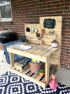 an outdoor kitchen made out of pallet wood