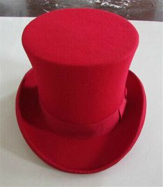 a red hat sitting on top of a white table