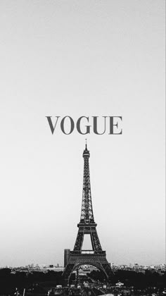 the eiffel tower in paris is lit up with words that read, vouge