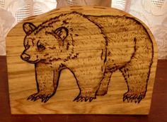 a wooden box with a drawing of a bear on it