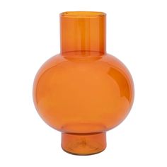 an orange glass vase sitting on top of a white table