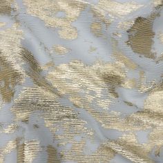 The pure luxury of this Aralia Silver-Gray and Gold Abstract Foiled Polyester Chiffon Plisse is perfect for any project. Abstract splashes of bright gold foiling spread over a plisse chiffon ground, which features a tactile, almost-ribbed hand thanks to its pleated or crinkled nature. Sheer and lightweight with a flexible and airy drape, chiffon is perfect for producing flowing garments. Dream up and design elegant Greek-inspired evening gowns, swirling maxi skirts, puff-sleeve blouses, and over Project Abstract, Mood Designer Fabrics, Plisse Fabric, Luxury Printing, Mood Fabrics, Gold Foil Print, Buy Fabric, Bright Gold, Puff Sleeve Blouse