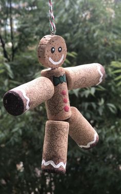 a homemade gingerbread man ornament hanging from a tree