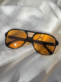 Black frame sunnies with amber lens Sunglass Photography, Sunglass Pouch, Popular Sunglasses, Vintage Sunglasses Retro, 70s Men, Sunglasses Women Aviators, Fashion Eye Glasses