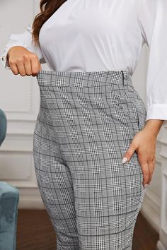 These Plus Size High Waist Black/Grey Plaid Elastic Waist Pants are perfect for any body shape, with their high waist design providing a flattering fit. The elastic waist allows for comfort and flexibility, while the black and grey plaid pattern adds a touch of style to any outfit. Upgrade your wardrobe with these versatile and chic pants. 95% Polyester, 5% Spandex Elastic Waistband Brand Size Dress Bust Waist Hip XS 0-2 31-32.5'' 23-24'' 31-34" S 4--6 33-35'' 25-26'' 35-37" M 8--10 35-36'' 27-28'' 38-39" L 12--14 38-40'' 29-31'' 40-42" XL 14-16 40-42'' 33.5-36'' 44-46" 2XL 18-20 42-44'' 37-40'' 47-50" 3XL 22-24 44-46'' 41-46'' 51-55" 4XL 26-28 46-48'' 47-50'' 56-60" Gray High-waist Bottoms With Elastic Waistband, Gray High Waist Bottoms With Elastic Waistband, High Waist Gray Bottoms With Elastic Waistband, Outfit Upgrade, Chic Pants, Winter Knit Hats, Grey Plaid, Elastic Waist Pants, Winter Knits