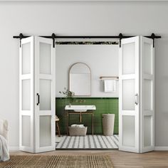 an open door leading to a bathroom with green tiles on the walls and flooring