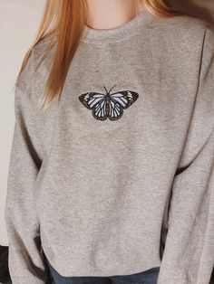 "Embroidered Butterfly Sweatshirt! -Embroidered on a cotton/polyester blend crewneck sweatshirt, this design is simple and minimalistic, perfect for every outfit! -Embroidery design measures 4.3\" x 4.3\". -See product pictures for shirt sizing chart. -All sweatshirts are handmade on an embroidery machine so there may be slight differences, but we only sell the shirts that meet our high-quality standards. -To maintain the quality of your shirt and the embroidery design make sure to wash with car Custom Embroidery Crew Neck Sweater, Basic Crew Neck Sweatshirt With Embroidered Graphics, Embroidered Crew Neck Sweatshirt With Relaxed Fit, Relaxed Fit Sweatshirt With Custom Embroidery And Crew Neck, Custom Embroidery Crew Neck Sweater For Streetwear, Custom Embroidery Relaxed Fit Crew Neck Sweatshirt, Embroidered Crew Neck Sweatshirt In Relaxed Fit, Relaxed Fit Crew Neck Sweater With Custom Embroidery, Custom Embroidered Crew Neck Sweater In Relaxed Fit