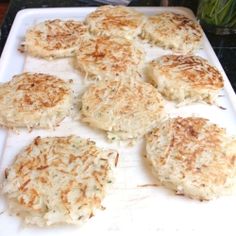 some food is laying out on a white tray and ready to be cooked in the oven