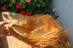 a straw hat sitting on top of a wooden table