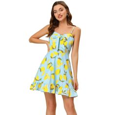 This lemon-printed dress is perfect for the spring and summer seasons. This polka-dot lemon-printed dress adds a sweet and feminine style. It features a ruffle trim along the hem and a sweetheart neckline design. With an allover pretty lemon-dot print on a fresh white fabric for an eye-catching look, you can easily pair this sleeveless short dress with sneaks and a messy bun for a casual outing, or dress it up with heels and your favorite accessories for a date night. Gold Dress Short, Sundress Blue, Lemon Spaghetti, Lemon Print Dress, Beach Mini Dress, Dolce Gabbana Dress, Sleeveless Short Dress, Spaghetti Strap Mini Dress, Mini Sundress