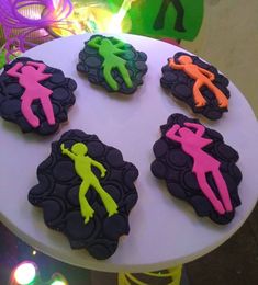 decorated cookies with neon colors on a white plate