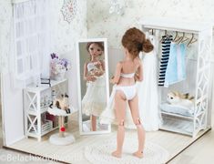 there is a doll standing in front of a mirror