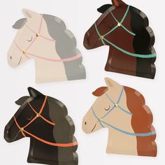 four horse shaped paper plates on a white background