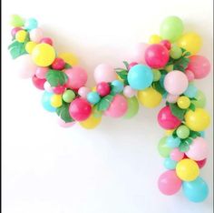 the letter n made out of balloons and leaves