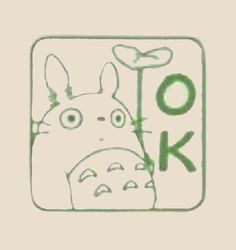 a drawing of a totoro with the word ok written in green on it