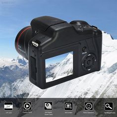 an image of a digital camera on top of a mountain with mountains in the background