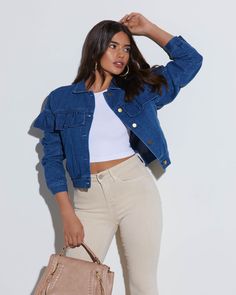 The Perez Denim Ruffle Jacket features feminine ruffles on the sleeves and at the bust. It has sleek, barely-there side pockets and looks great layered over crop tops. Regular fit Collared Ruffle detailing Side pockets Front button closures 97% Cotton 3% Spandex Cropped Denim Jacket With Pockets, Ruffled Denim Blue Denim Jacket, Chic Cropped Denim Jacket With Pockets, Trendy Ruffled Denim Top For Fall, Casual Fitted Denim Jacket With Ruffles, Casual Denim Outerwear With Ruffles, Trendy Ruffled Denim Jacket For Fall, Fall Denim Jacket With Ruffles, Fitted Denim Outerwear With Ruffles